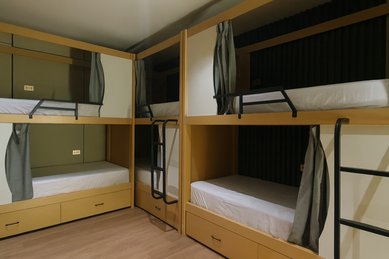 10-bed male dorm with capsule bunk beds and privacy curtains at BuenaSentro Hostel Manila.