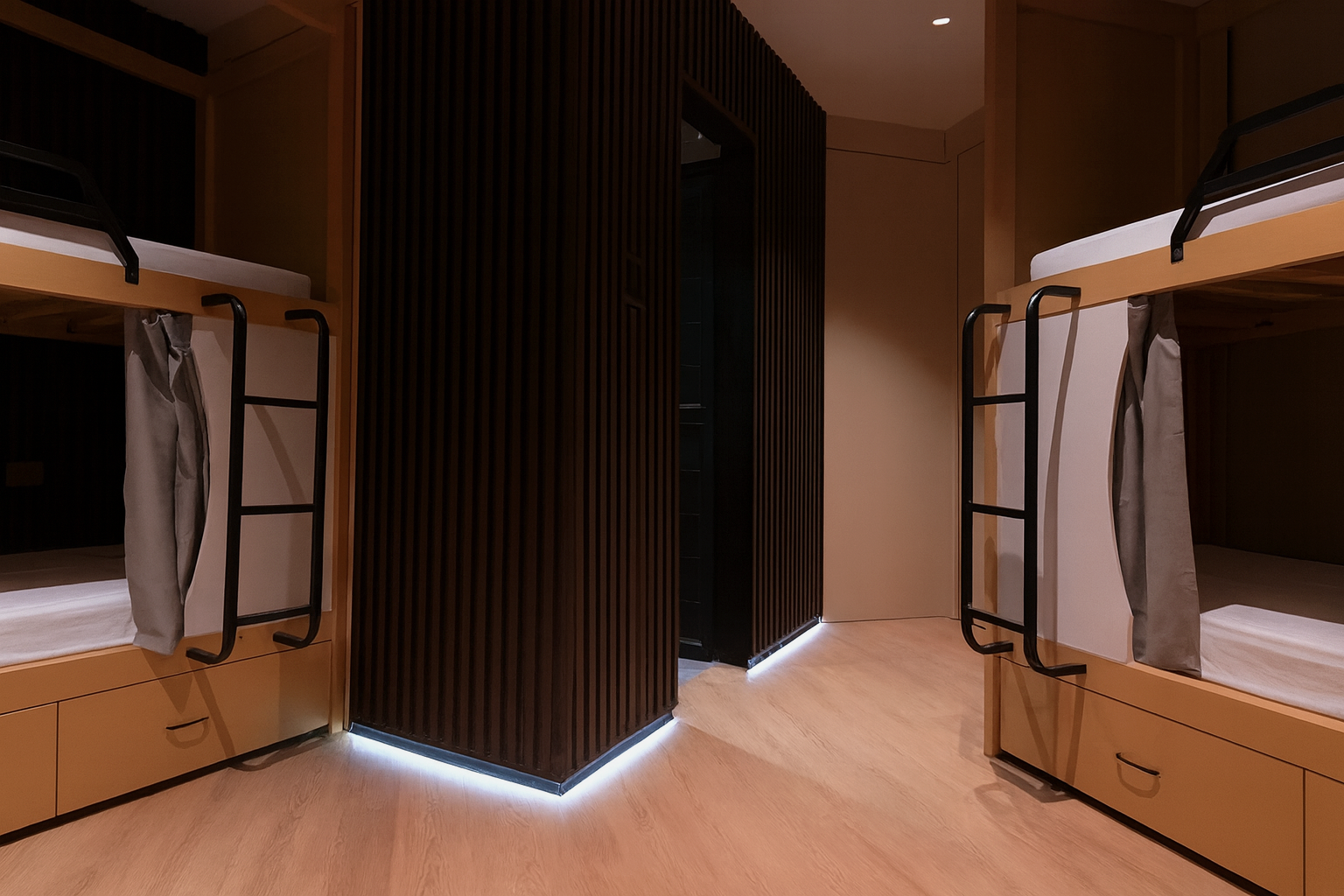 Modern 10-bed male dormitory with capsule-style bunk beds at BuenaSentro Hostel, Manila